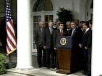 Fotografa George W. Bush, rodeado de congresistas que apoyan el ataque a Irak